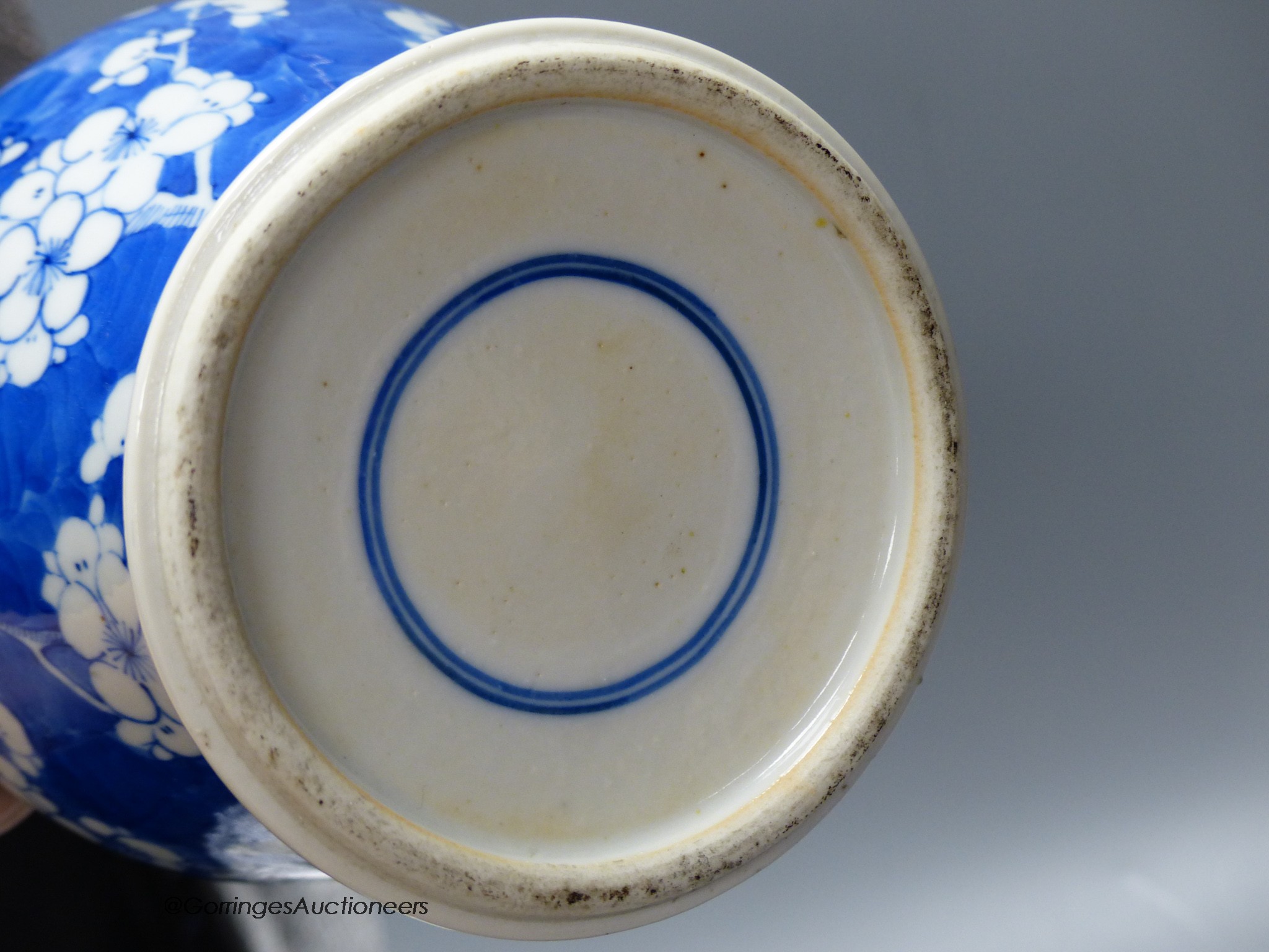 A pair of Chinese blue and white 'dragon' bottle vases, a prunus jar and cover, all late 19th century